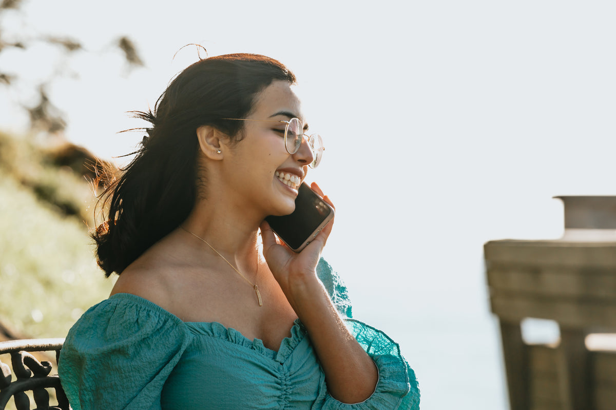 smiling woman calling on phone